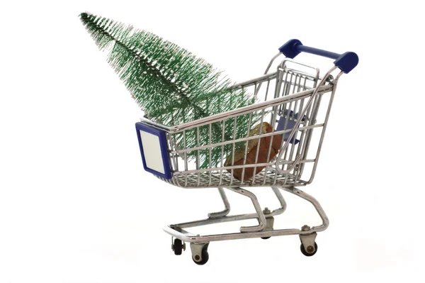 Grocery cart with Christmas tree isolated on white — Stock Photo, Image