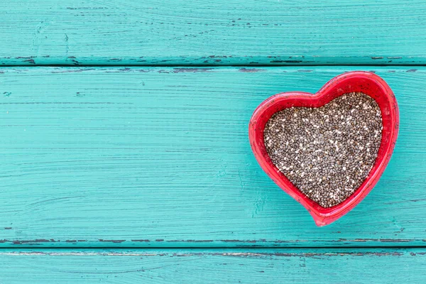 Heart shape ceramic bowls with Chia seeds — Stock Photo, Image