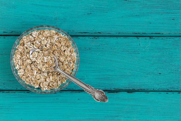 Oatmeal on a vintage wood background — Stock Photo, Image