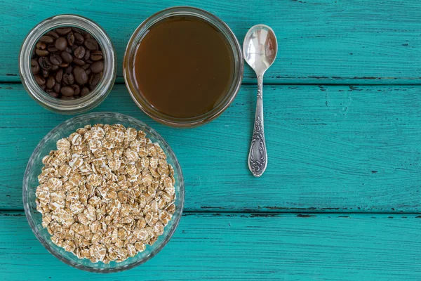 Oatmeal on a vintage wood background — Stock Photo, Image