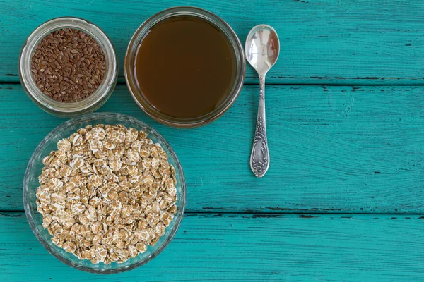 Oatmeal on a vintage wood background — Stock Photo, Image