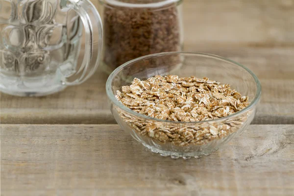 Oatmeal on a vintage wood background — Stock Photo, Image