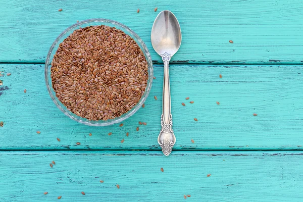 Flax seeds on a wood vintage background — Stock Photo, Image