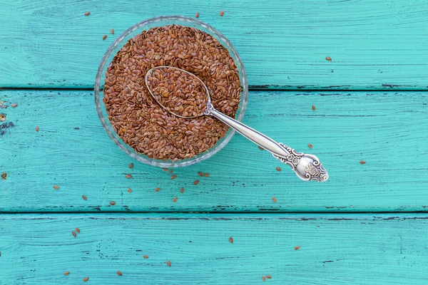 Flax seeds on a wood vintage background — Stock Photo, Image