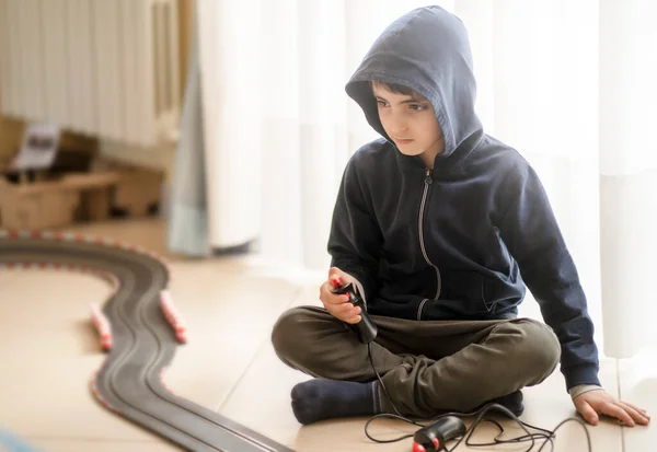 Concentrated Look Lonely Child Sitting Ground Playing Electric Track Lockdown — Stock Photo, Image