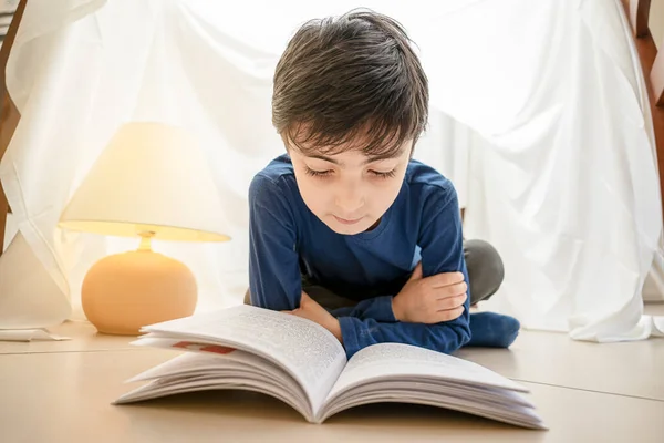 Adorable Italian Caucasian Kid Reading Book Lying Tent Home — Stock Photo, Image