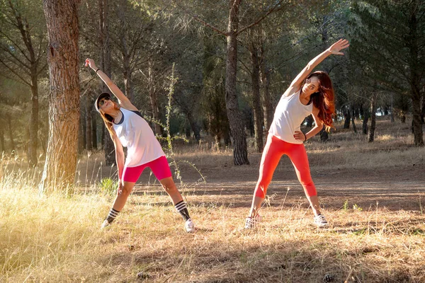 Fitness Two Female Runners Stretching Legs Outdoors Park Summer — Stock Photo, Image