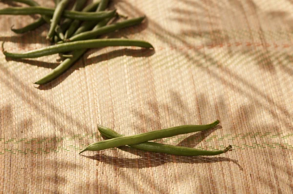 Green beans near the window — Stock Photo, Image