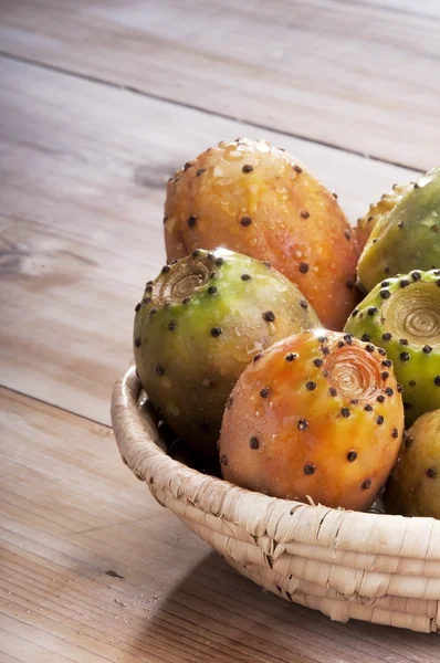 Basket of Prickly Pear on wood — Stock Photo, Image