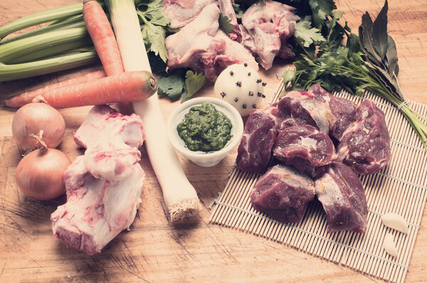 ingredients for meat broth with green sauce whit tone color in i