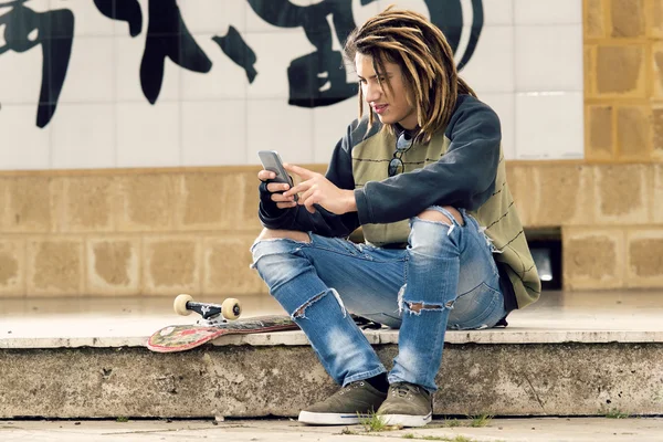 Young fashion guy with smartphone — Stock Photo, Image