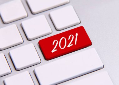 Klavyede 2021 yılbaşı metni. Yeni yıl, Gregoryen takviminde yılın ilk günüdür.