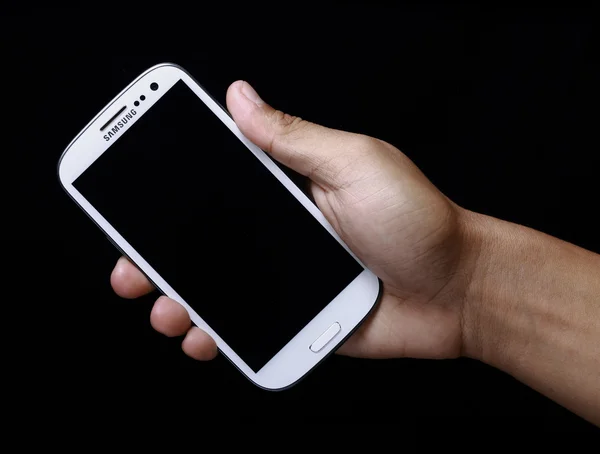 Hand holding smartphone — Stock Photo, Image