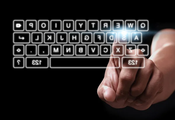 Hand pressing on button of digital virtual keyboard — Stock Photo, Image