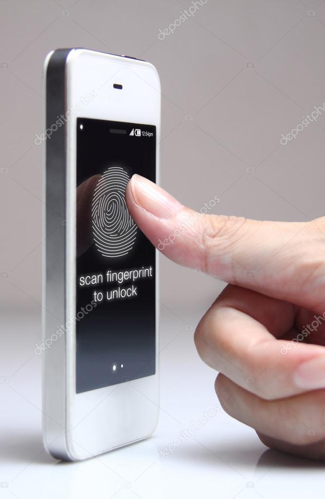 Hand touching smartphone to unlock. 