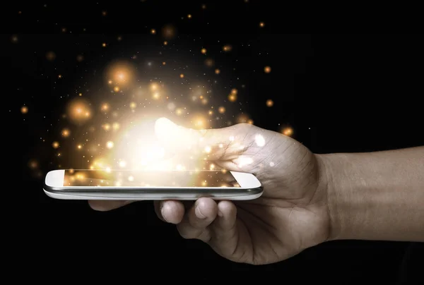 Oro magia estrellas luz en el teléfono inteligente —  Fotos de Stock