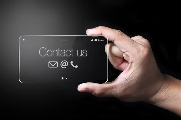 Neem contact met ons op met smartphone en hand — Stockfoto