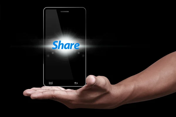 Compartir icono con smartphone y mano — Foto de Stock