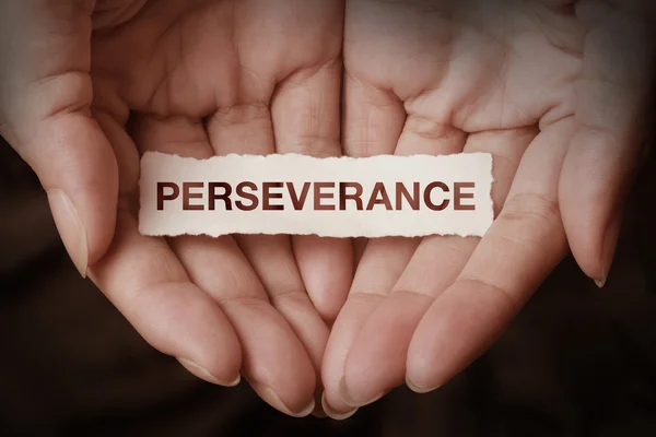 Texto de perseverancia en la mano — Foto de Stock