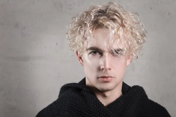 young blond man in the studio, the northern type of man,