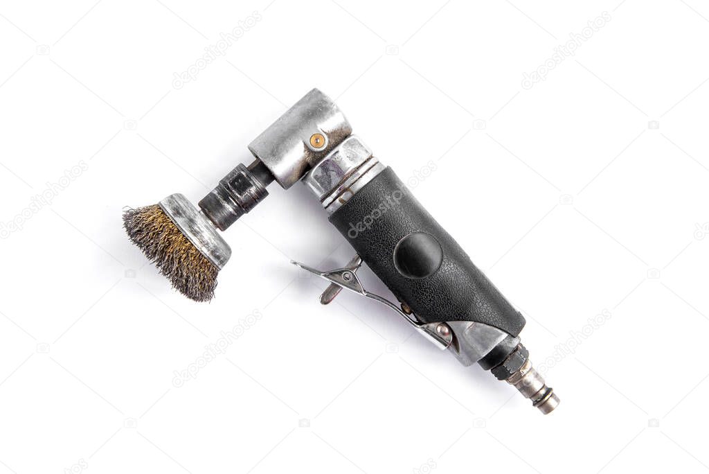 Pneumatic drill with wire brush isolated on white background.