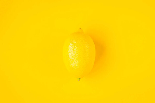 Lemon on yellow background.