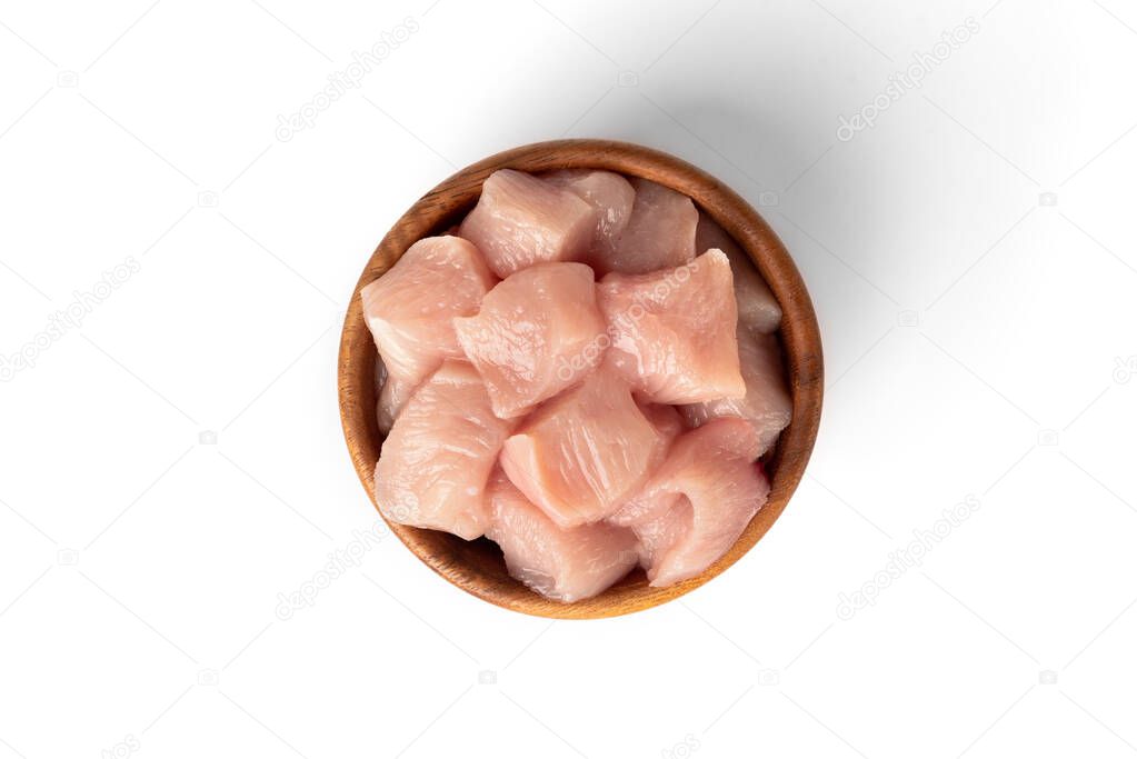 Diced raw chicken breast or fillets isolated on white background.