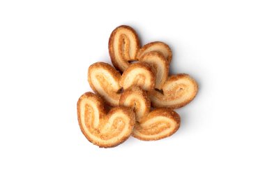 Beyaz arka planda izole edilmiş palmier kurabiyeler veya kabarık pasta kulakları.