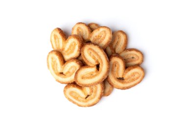 Beyaz arka planda izole edilmiş palmier kurabiyeler veya kabarık pasta kulakları.