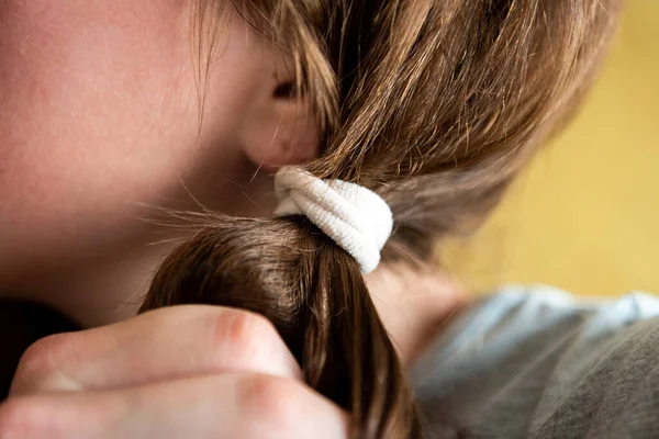 Elastic band on the hair.