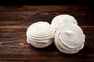 Russian marshmallow on dark wooden background.