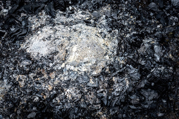 Extinct fire on the grass.