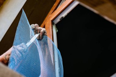 Cutting facade grid on construction site.