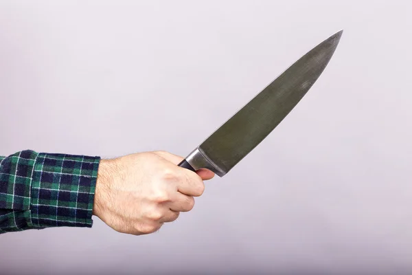 Imagen Conceptual Hombre Que Mantiene Gran Cuchillo Afilado Sobre Fondo — Foto de Stock