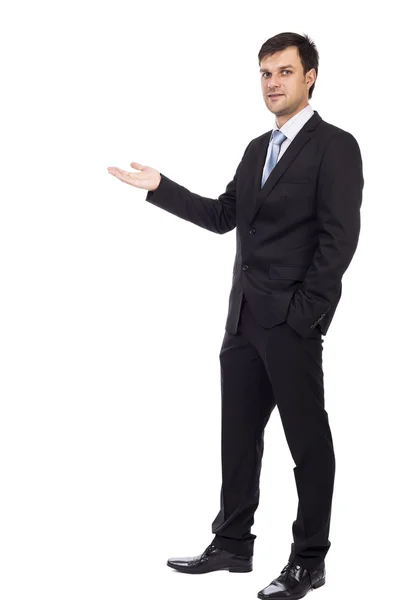 Handsome young businessman making welcome gesture — Stock Photo, Image