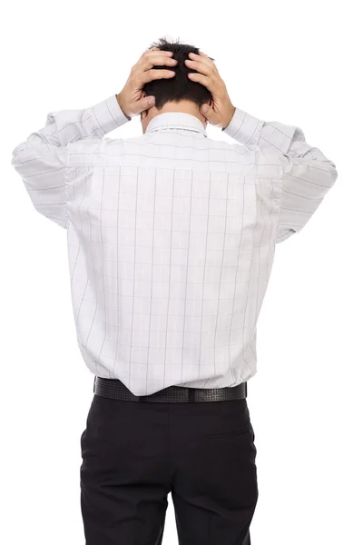 Young businessman standing back holding hands on head — Stock Photo, Image