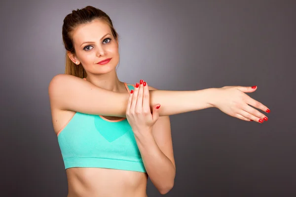 Young fitness woman doing exercises — Stock Photo, Image