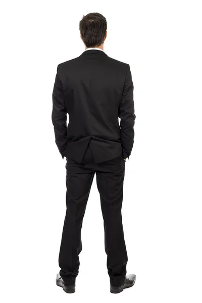 Ganzkörperporträt eines jungen Geschäftsmannes, Rückseite, mit Händen lizenzfreie Stockfotos