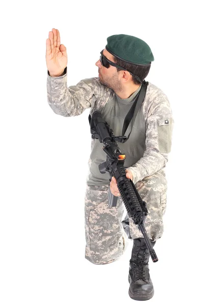 Portrait of soldier or commander holding his rifle and making si — Stock Photo, Image