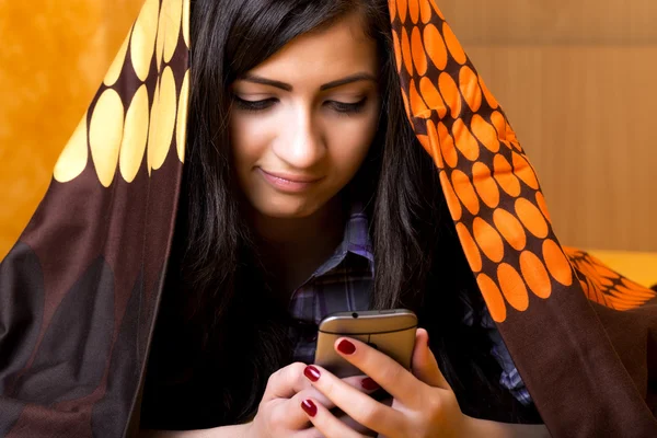 Closeup portrait of beautiful teenage girl using mobil phone hid — Stock Photo, Image