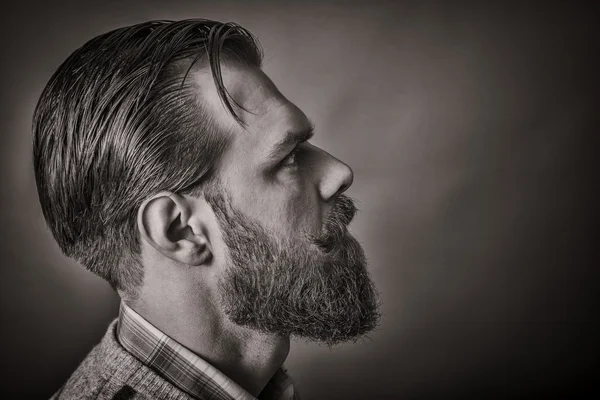 Closeup of a handsome young man with retro look, side view — Stock Photo, Image