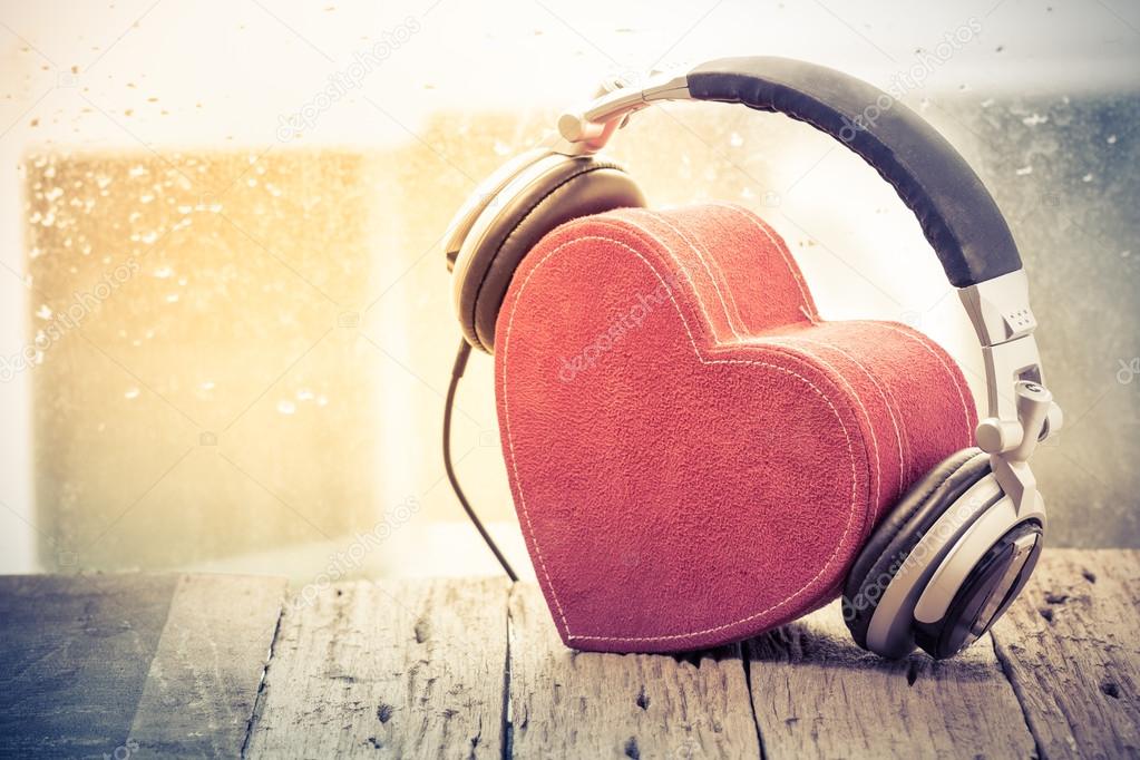 Headphones with red heart. love music. vintage retro