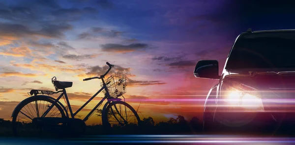 Front of the car with bicycle on morning sky background, EV car concept