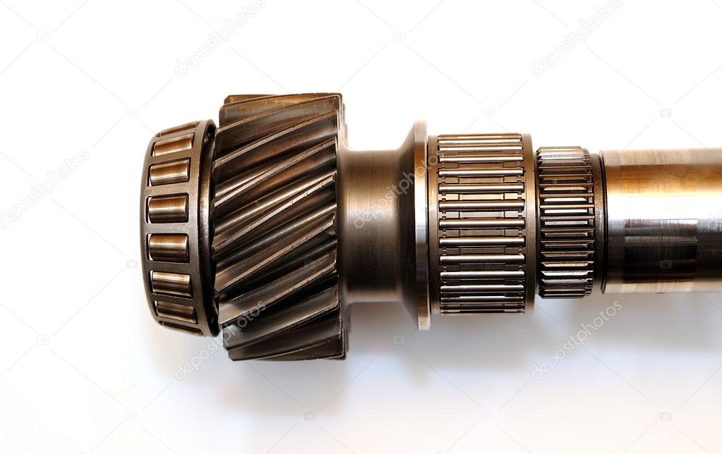 Axle from a car gearbox isolated on white background.