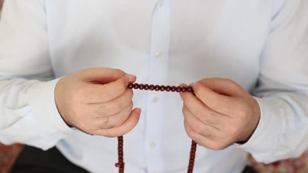 Muslim praying with bead for Allah — Stock Video