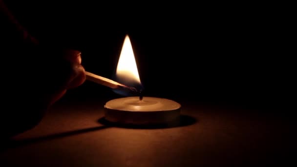 Lighting candle darkness — Stock Video