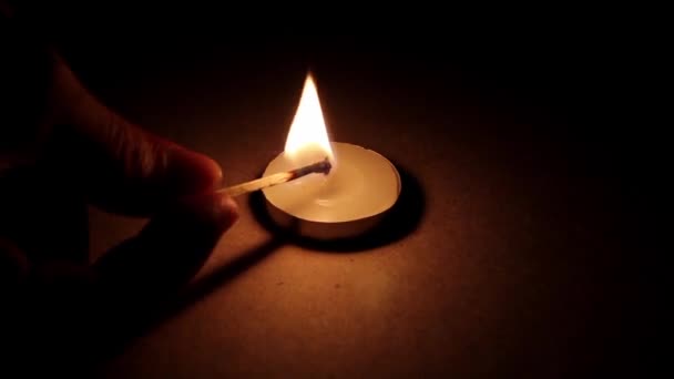 Lighting candle darkness — Stock Video