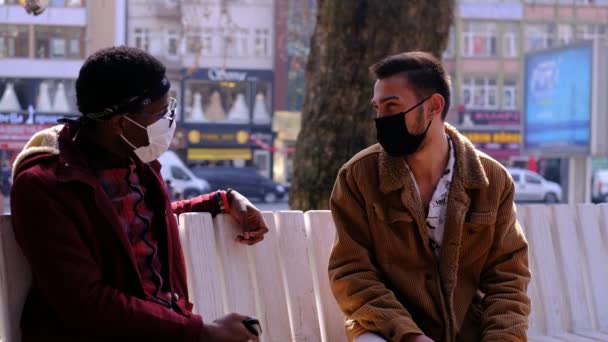 Black and white mask young man talking — Stock Video