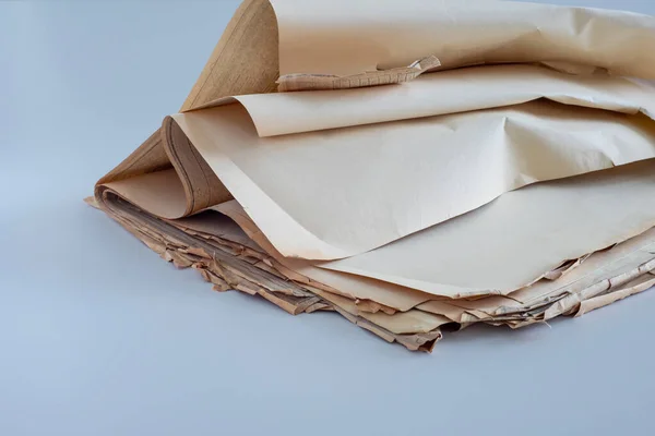 OldOld, randomly folded paper, as waste paper.