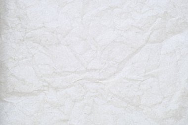 Buruşmuş kağıt bir pencereye karşı soyut bir arkaplan olarak.